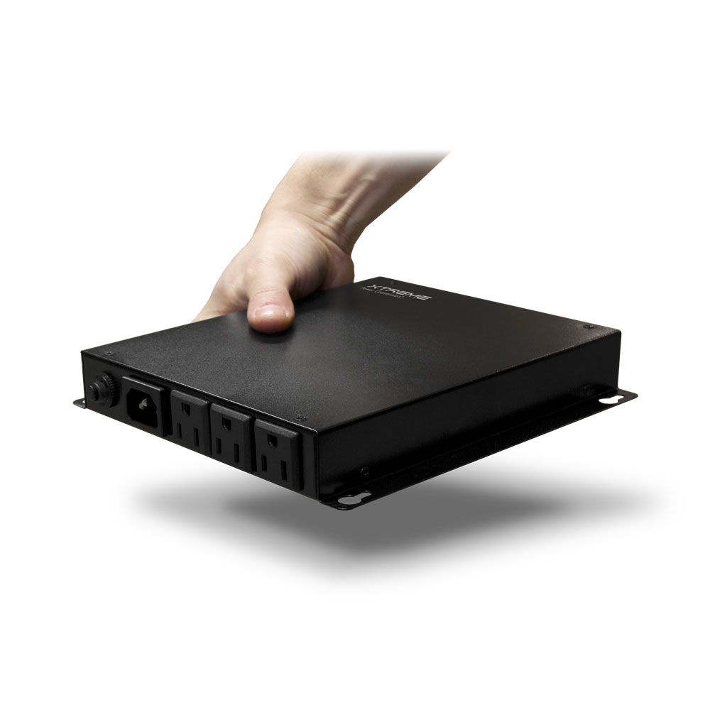 A hand is holding the back of a black box.